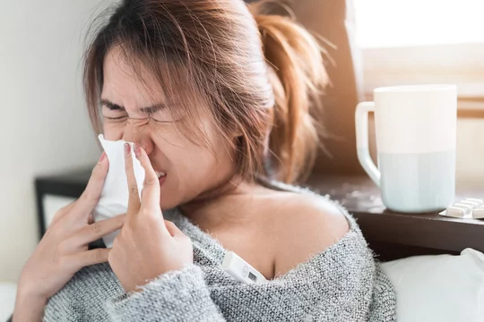 Stockfoto Sick asian woman have hight fever flu and sneezing into tissue on  bed in bedroom, Medical and health concept, Selective focus. | Adobe Stock